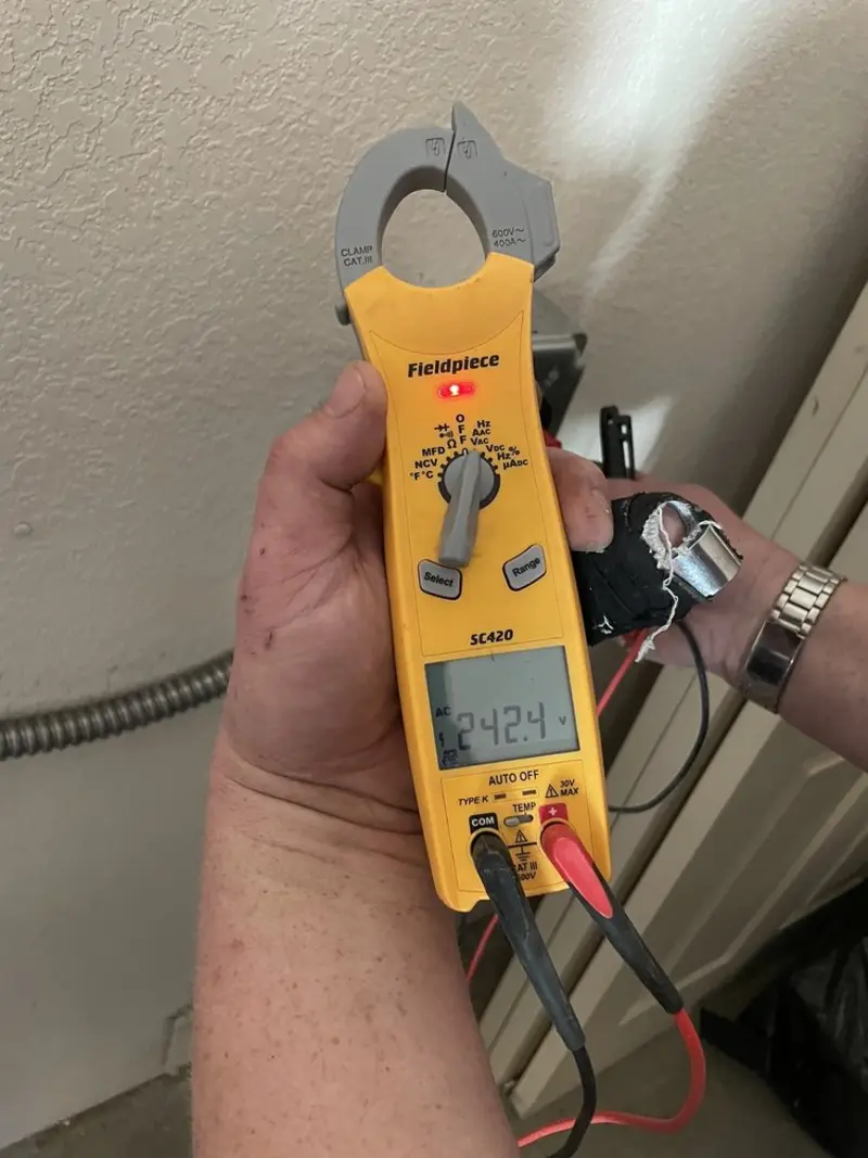 Voltage testing with clamp meter during Outlet Installation in Derby